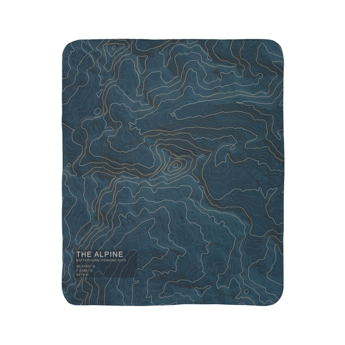 The Alpine Matterhorn topographic fleece blanket shown flat in navy