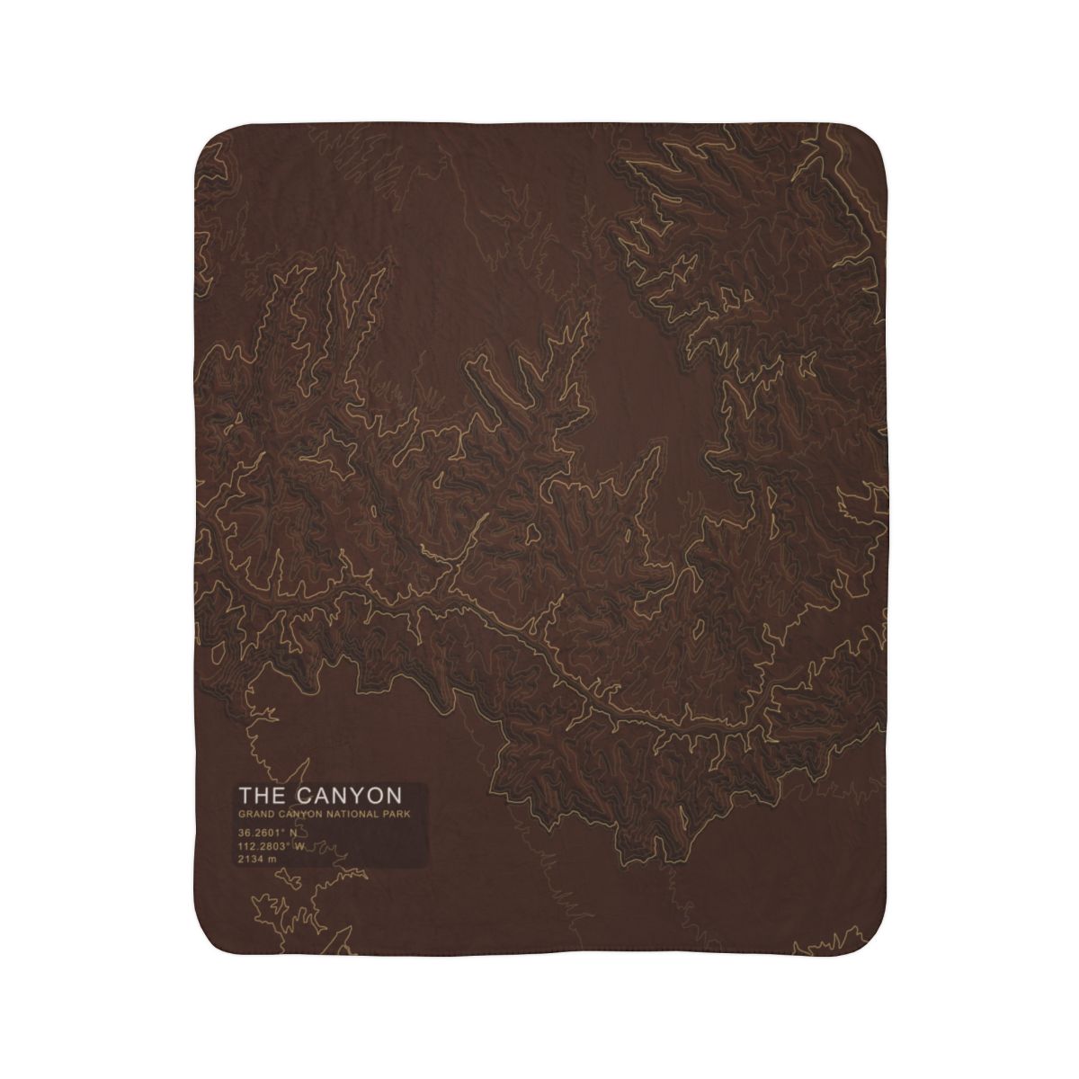 The Canyon Grand Canyon topographic fleece blanket shown flat in dark rust