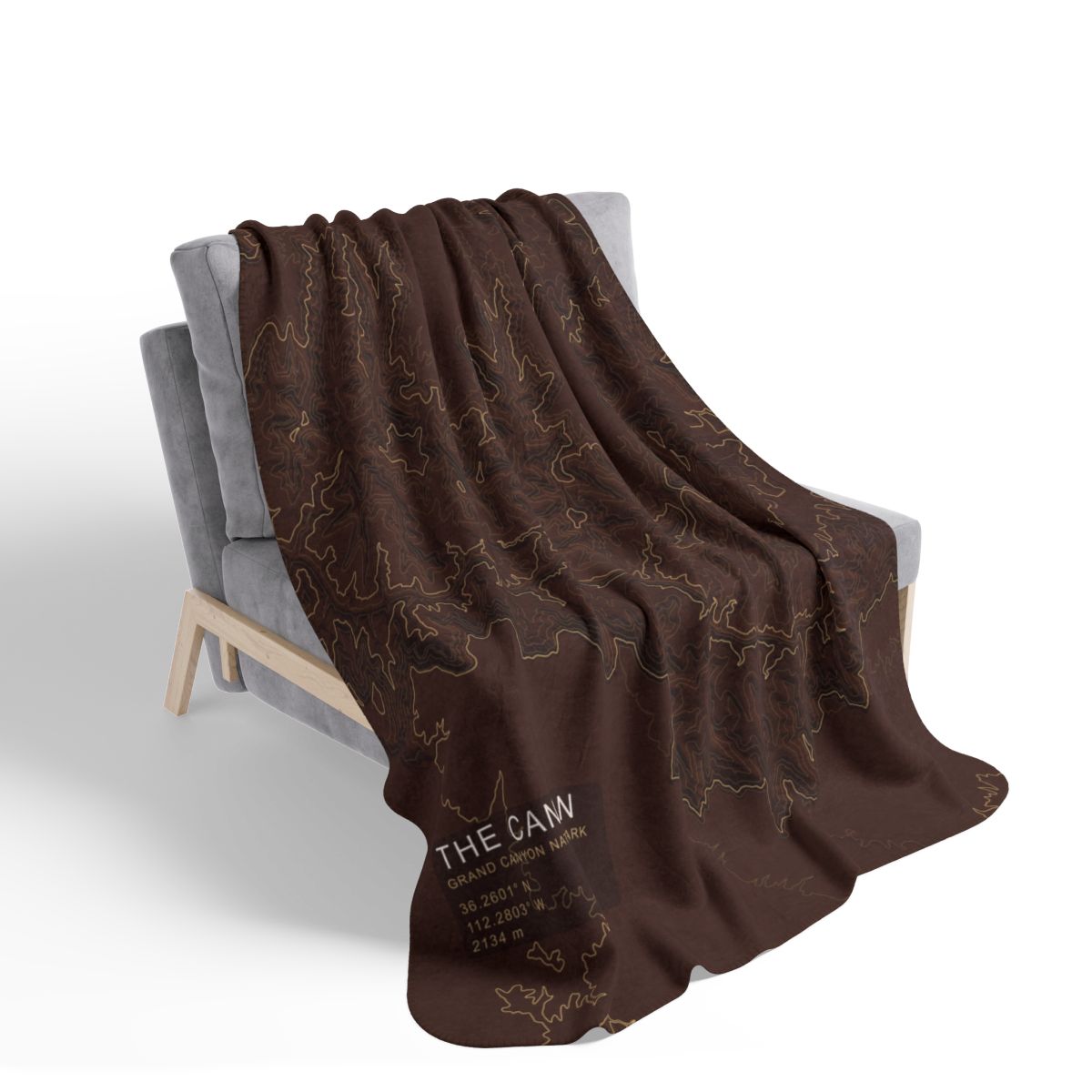 The Canyon blanket draped over a chair with gray fleece reverse visible