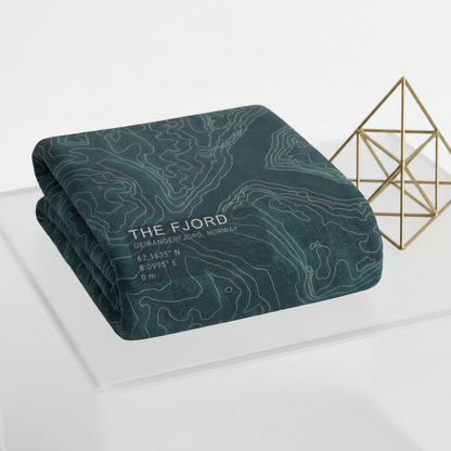 Folded The Fjord Geirangerfjord terrain blanket on a light table