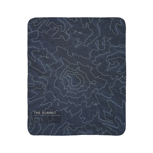 The Summit Mount Rainier topographic fleece blanket shown flat in navy