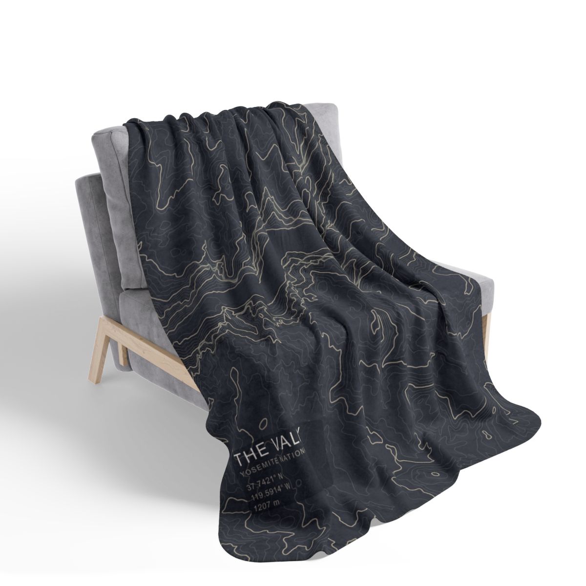 The Valley Yosemite blanket draped over a chair with gray fleece reverse visible